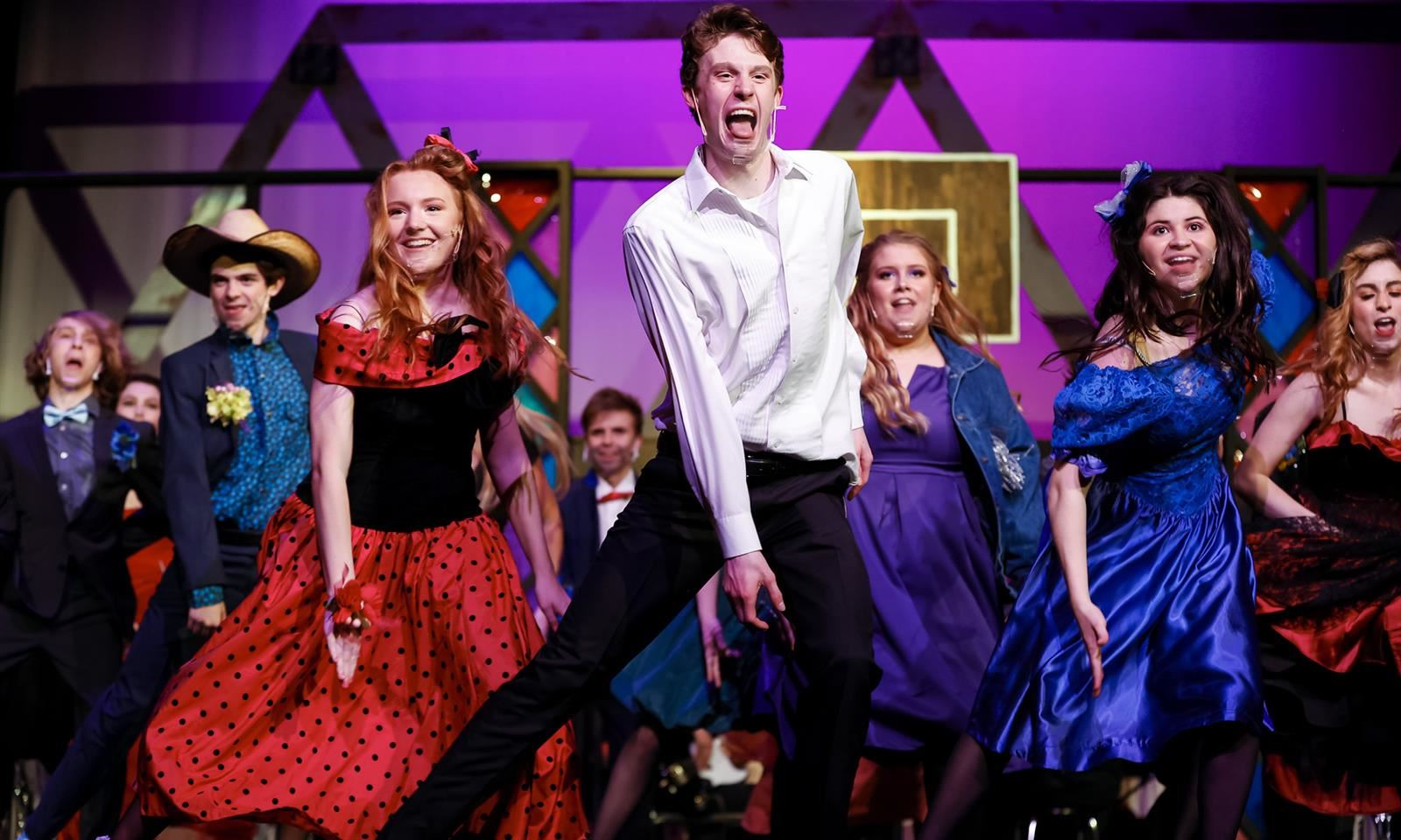 Students perform onstage